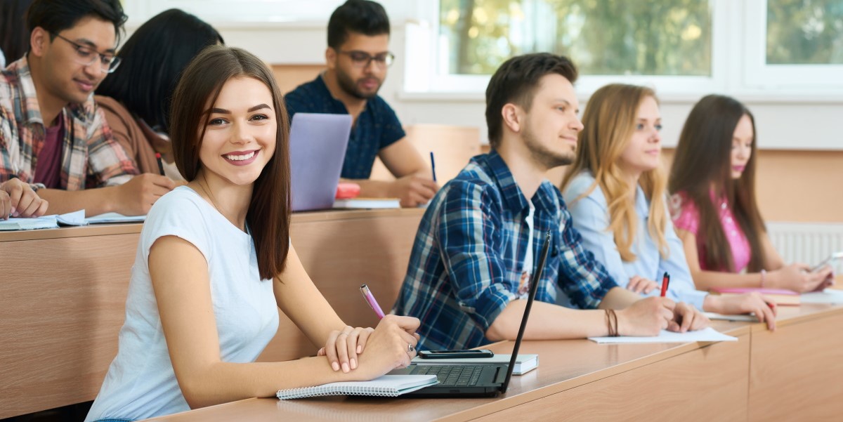 young student looking camera sitting university